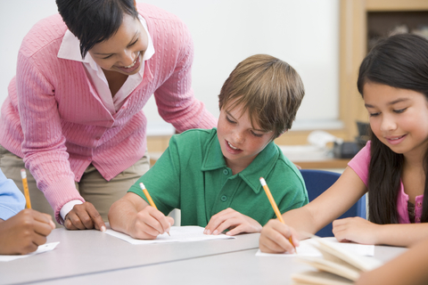 Teacher Helping Student