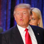 Republican U.S. presidential candidate Donald Trump makes a face as he and his wife Melania and members of their family leave the stage at his caucus night rally in Des Moines